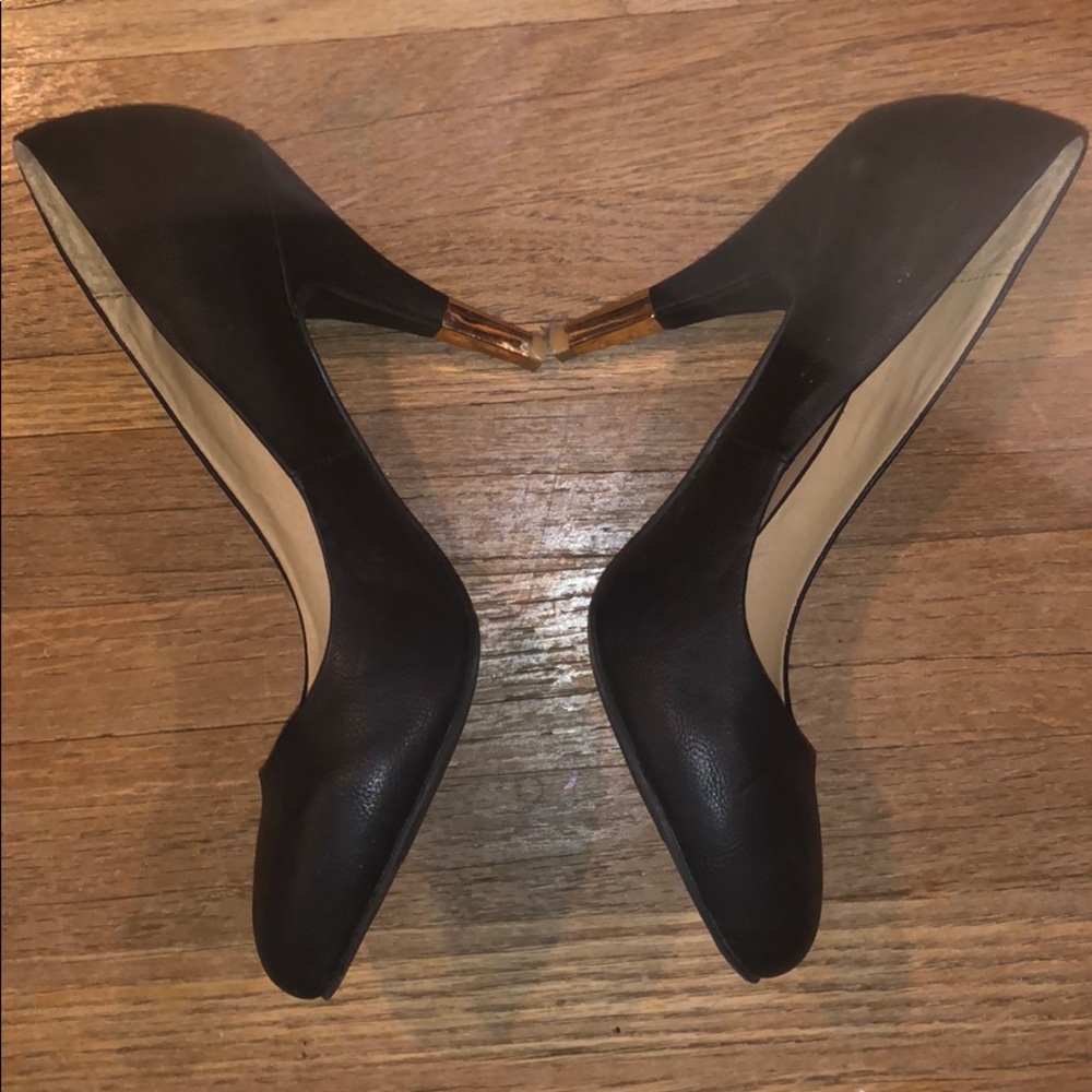 Kimchi Blue black with gold heel pumps.